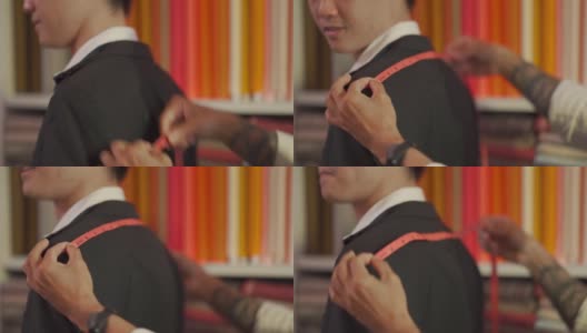 亚洲华人高级男裁缝为他的客户量身定做新的运动夹克高清在线视频素材下载