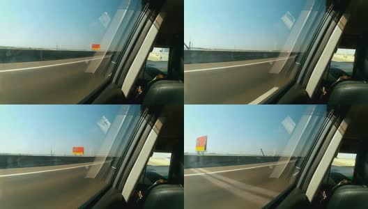 观点:在高速公路上开车时从侧窗看。高清在线视频素材下载
