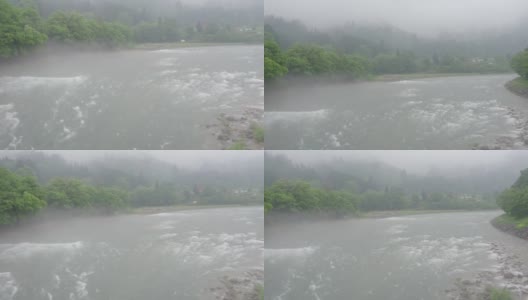 白川吾村附近的Shogawa河雨天高清在线视频素材下载