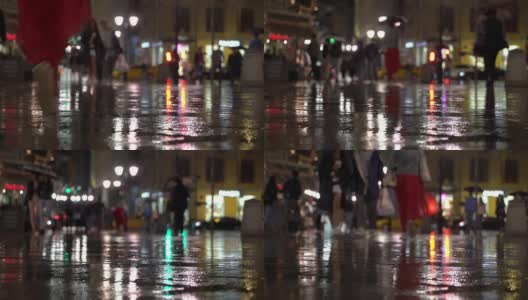 摘要雨夜现代都市，自然暗调。在路灯的照耀下，雨点落在五颜六色的沥青上。打着伞，穿着时髦红裙的女孩走在行人中间。现代城市生活方式高清在线视频素材下载