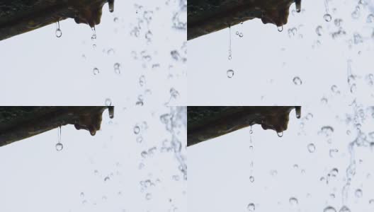 Slow motion of water drop fall from eaves高清在线视频素材下载