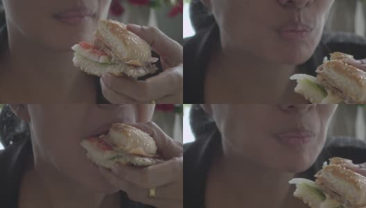 女商人在餐馆吃汉堡包高清在线视频素材下载