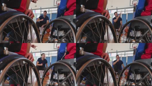 教练与男性轮椅篮球运动员的战略高清在线视频素材下载