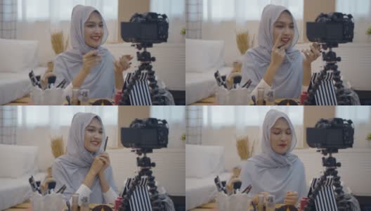 年轻的亚洲穆斯林女性美容影响博主录制视频与化妆品高清在线视频素材下载
