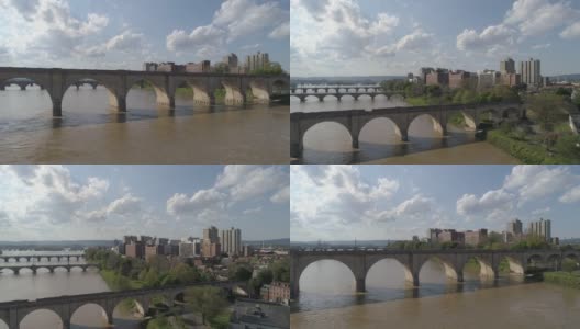 历史悠久的胡桃街铁路桥，市场街桥，以及其他横跨萨斯奎哈纳河的桥梁，在宾夕法尼亚州哈里斯堡市中心的远处可以看到。无人机制作的航拍视频，带有电影的渐增平移摄像机运动。高清在线视频素材下载