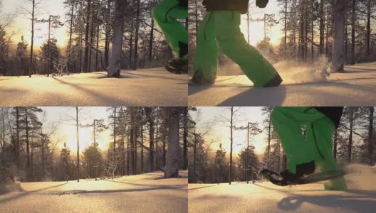 慢动作雪鞋和奔跑在新鲜的雪在森林在金色的日落高清在线视频素材下载
