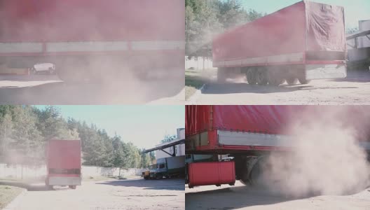 一辆向右转的红色卡车。空气中的尘云高清在线视频素材下载