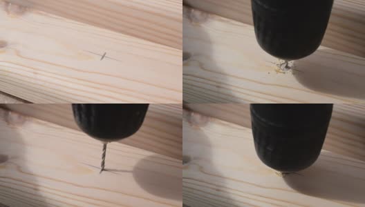 用钻头在松木板上钻一个小孔高清在线视频素材下载