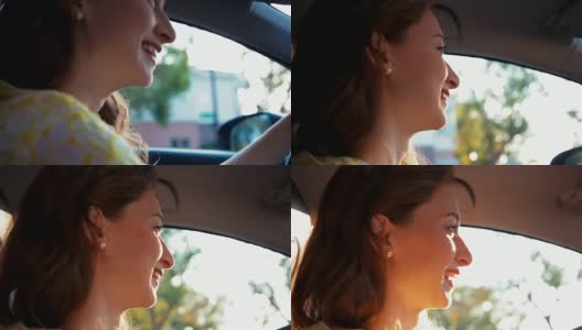近距离的年轻女子开车和微笑高清在线视频素材下载