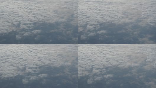 乘飞机旅行。从飞机窗口鸟瞰。美丽的cloudscape。高清在线视频素材下载