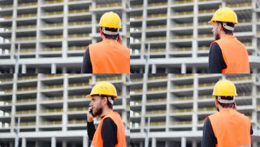 工程师或工人戴着白色头盔在模糊的建筑工地背景前打电话。高清在线视频素材下载