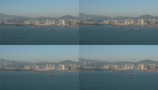 香港维多利亚港工业港附近的天际线、海岸和船只高清在线视频素材下载