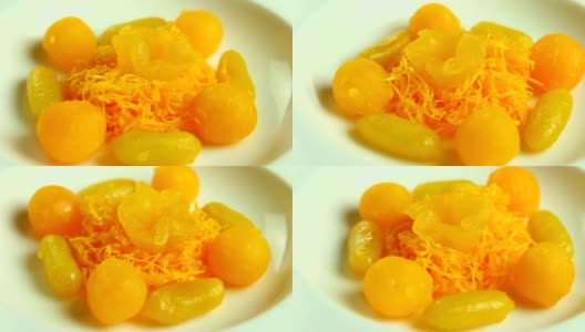 金蛋黄滴和球盘甜点高清在线视频素材下载