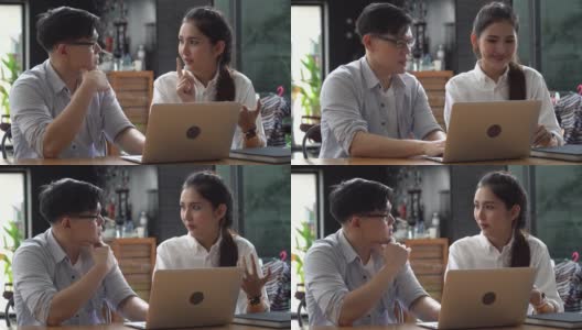 年轻的亚洲商业夫妇使用笔记本电脑一起在咖啡店工作。大学生讨论项目规划。企业家在工作场所与女性合作的策略高清在线视频素材下载