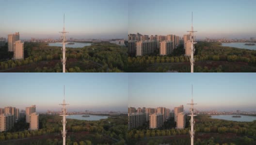 日落时5G蜂窝通信塔的鸟瞰图高清在线视频素材下载