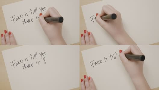 女人的手写假的直到你用黑色记号笔在白纸上写励志名言高清在线视频素材下载