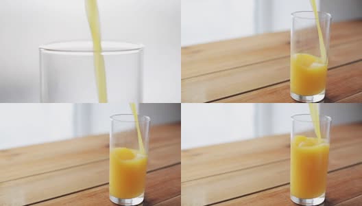 橙汁倒进木桌上的玻璃杯里高清在线视频素材下载