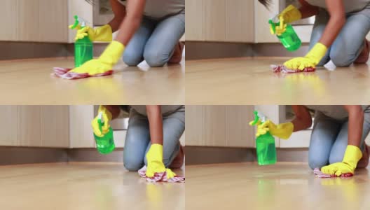 一个女人在打扫厨房的地板高清在线视频素材下载