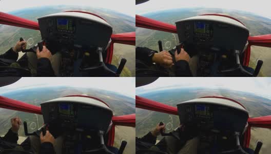 在运动飞机上的极端教训，兴奋的男子看着控制面板高清在线视频素材下载