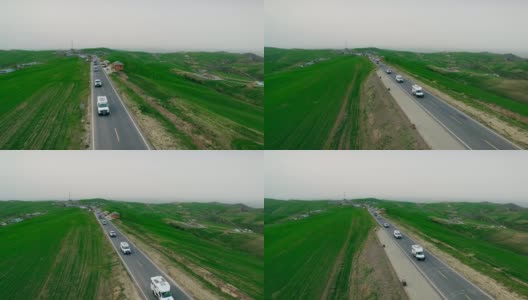 汽车在中国新疆的乡村道路上行驶的鸟瞰图。高清在线视频素材下载