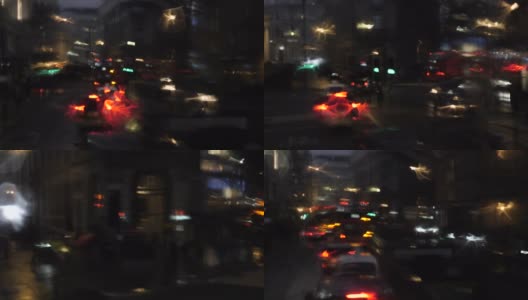 在雨天，从公共汽车窗口散焦的前灯和城市灯光高清在线视频素材下载