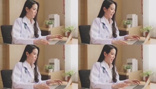 亚洲女医生通过视频电话会议，远程医疗或远程医疗概念与病人交谈高清在线视频素材下载