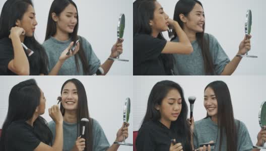 两个亚洲女人在家里化妆高清在线视频素材下载