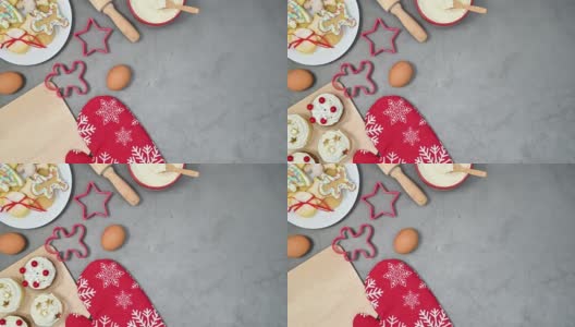 圣诞杯蛋糕和姜饼饼干出现在桌子上的烘焙材料。停止运动高清在线视频素材下载