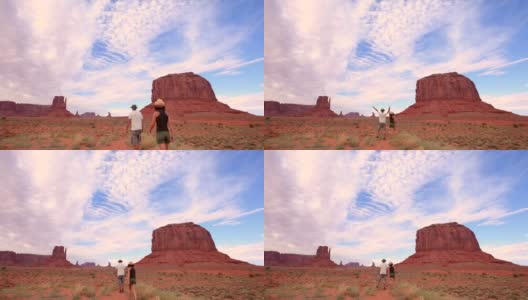 在犹他州纪念碑谷散步的一对夫妇。美国高清在线视频素材下载
