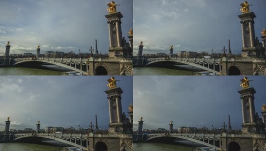 时间流逝的巴黎城市景观，塞纳河，大桥亚历山大三世和埃菲尔铁塔在一个多云的日子。高清在线视频素材下载