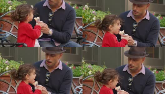 可爱的女孩和爸爸一起吃冰淇淋高清在线视频素材下载