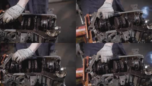 近距离拍摄的男子的手，谁工作在机动车辆的手套，人们修理化油器与钥匙高清在线视频素材下载
