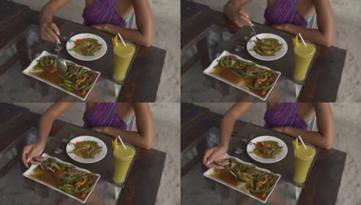 女人的手把肉和蔬菜放在盘子里高清在线视频素材下载