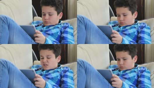 小男孩在用数码平板电脑高清在线视频素材下载