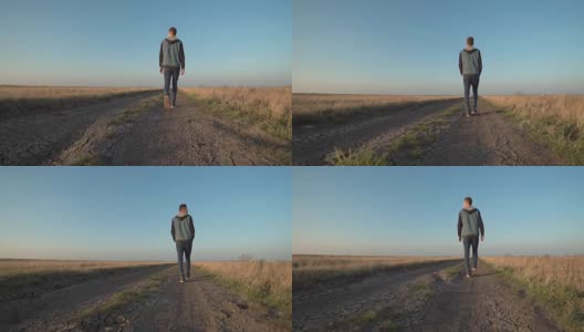 一个年轻人走在乡间小路上高清在线视频素材下载