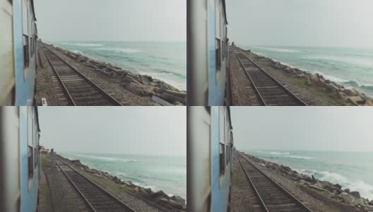 火车在海边的铁路上高清在线视频素材下载