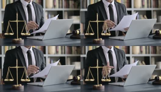 律师在法庭上用笔记本电脑手写笔记的特写镜头高清在线视频素材下载