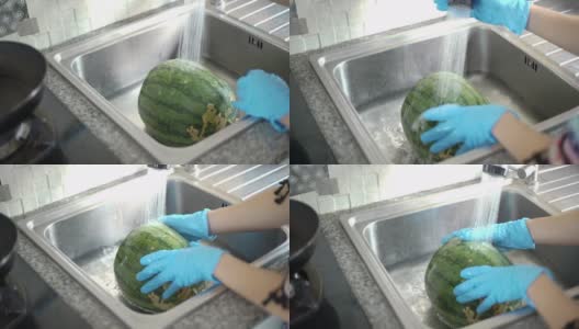 女人手拉手洗西瓜高清在线视频素材下载