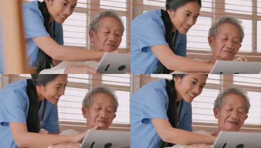 亚洲老年妇女与年轻的黑人女护士医生交谈，帮助患者在家里进行平板电脑治疗Covid-19病毒的教育。教育、医疗、护理、技术、老年护理、退休、志愿者、养老院、冠状病毒或Covid-19，家庭护理人员高清在线视频素材下载