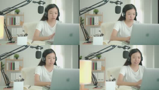 亚洲女学生或女商人远程工作和播客从家里与电脑笔记本电脑。社交距离概念在covid-19疫情下独自在家工作。高清在线视频素材下载