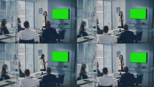 多元化办公室会议室会议:成功的亚洲女商人用绿屏彩键墙电视向投资者展示产品。电子商务战略。提升广角镜头高清在线视频素材下载