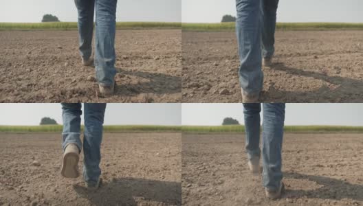 跟着农民的脚走在空旷的农田里，犁过的土很好高清在线视频素材下载