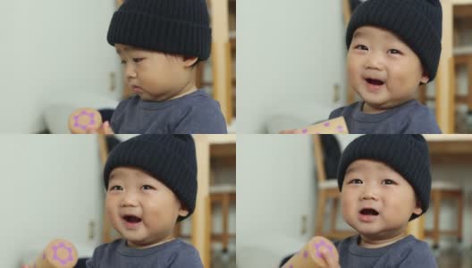 11个月大的亚洲婴儿经常微笑的肖像。高清在线视频素材下载