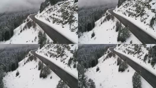 汽车在冬季大雪中在高速公路上行驶高清在线视频素材下载