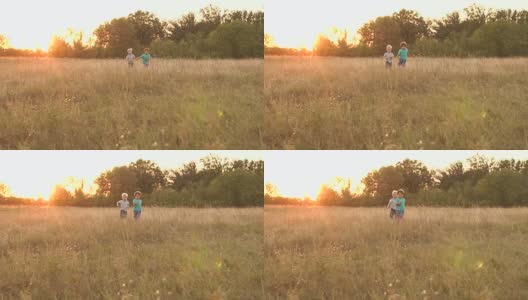 两个小男孩在夕阳下跑过田野，慢腾腾的莫高清在线视频素材下载