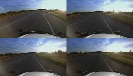 骑车人骑着摩托车在高速公路上行驶，戴着头盔高清在线视频素材下载