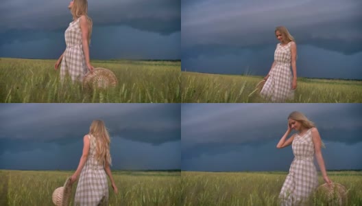 年轻美丽的灵感女孩是走在田野的雨天，自由的概念高清在线视频素材下载