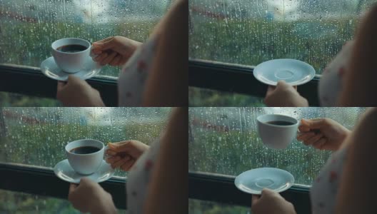 下雨天靠窗喝咖啡的女人高清在线视频素材下载
