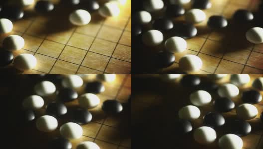 围棋棋盘游戏，用黑和白的石头高清在线视频素材下载