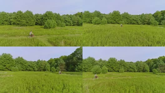 15岁少女骑自行车在草地上的小径在ed. Poconos，宾夕法尼亚州高清在线视频素材下载